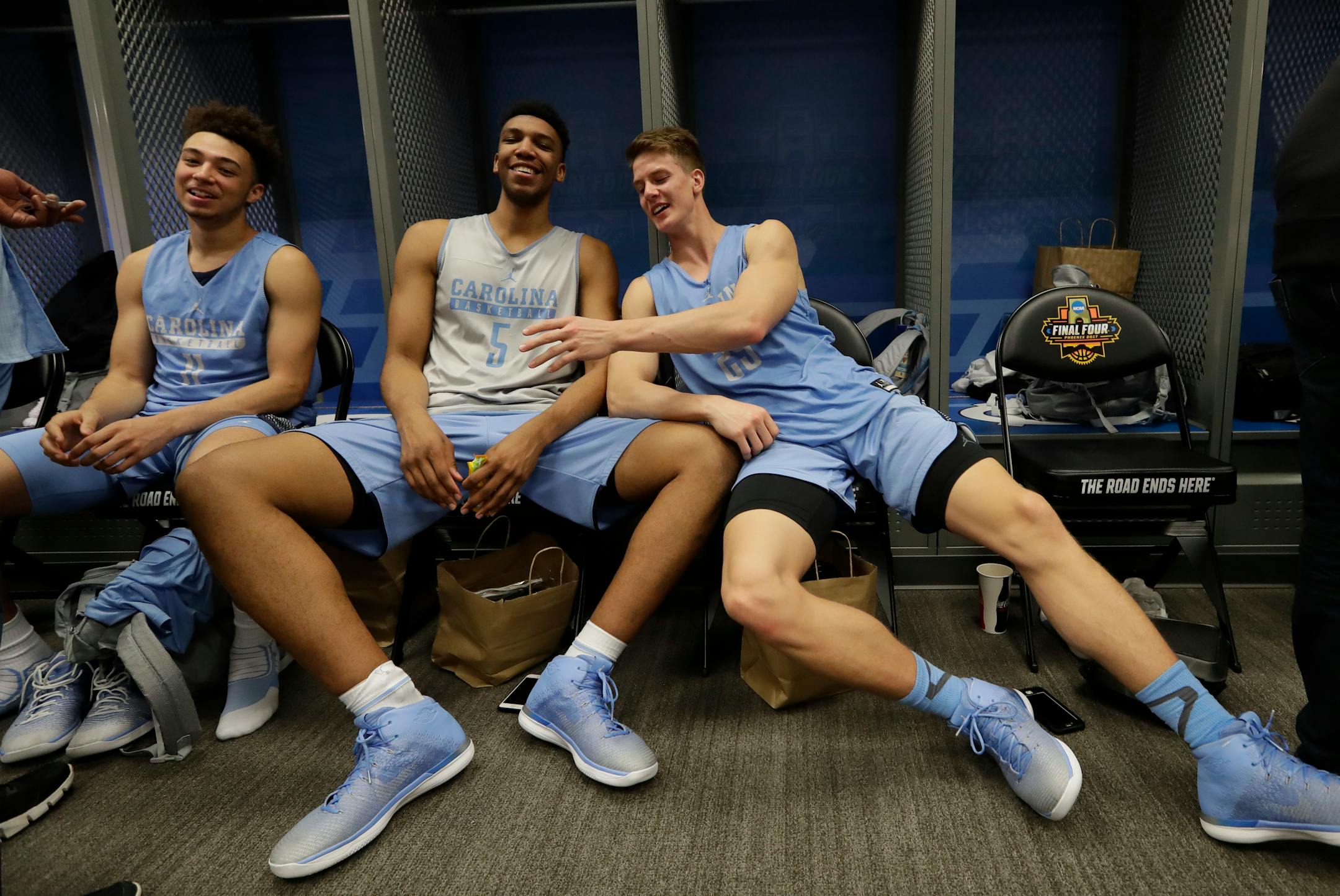 North Carolina's Shea Rush, left to right, Tony Bradley and Aaron Rohlman have some fun after a practice session for their NCAA Final Four tournament college basketball semifinal game Thursday, March 30, 2017, in Glendale, Ariz. (AP Photo/David J. Phillip)