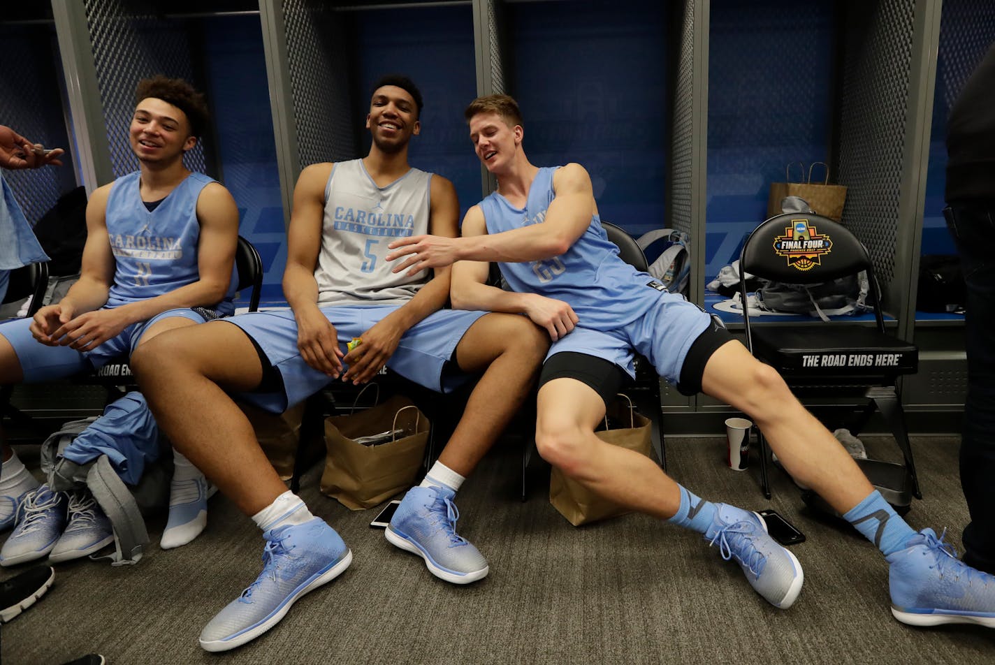 North Carolina's Shea Rush, left to right, Tony Bradley and Aaron Rohlman have some fun after a practice session for their NCAA Final Four tournament college basketball semifinal game Thursday, March 30, 2017, in Glendale, Ariz. (AP Photo/David J. Phillip)