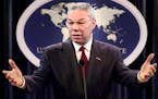 Then-Secretary of State Colin Powell talks with reporters during a news conference at the State Department of State in Washington in 2001.
