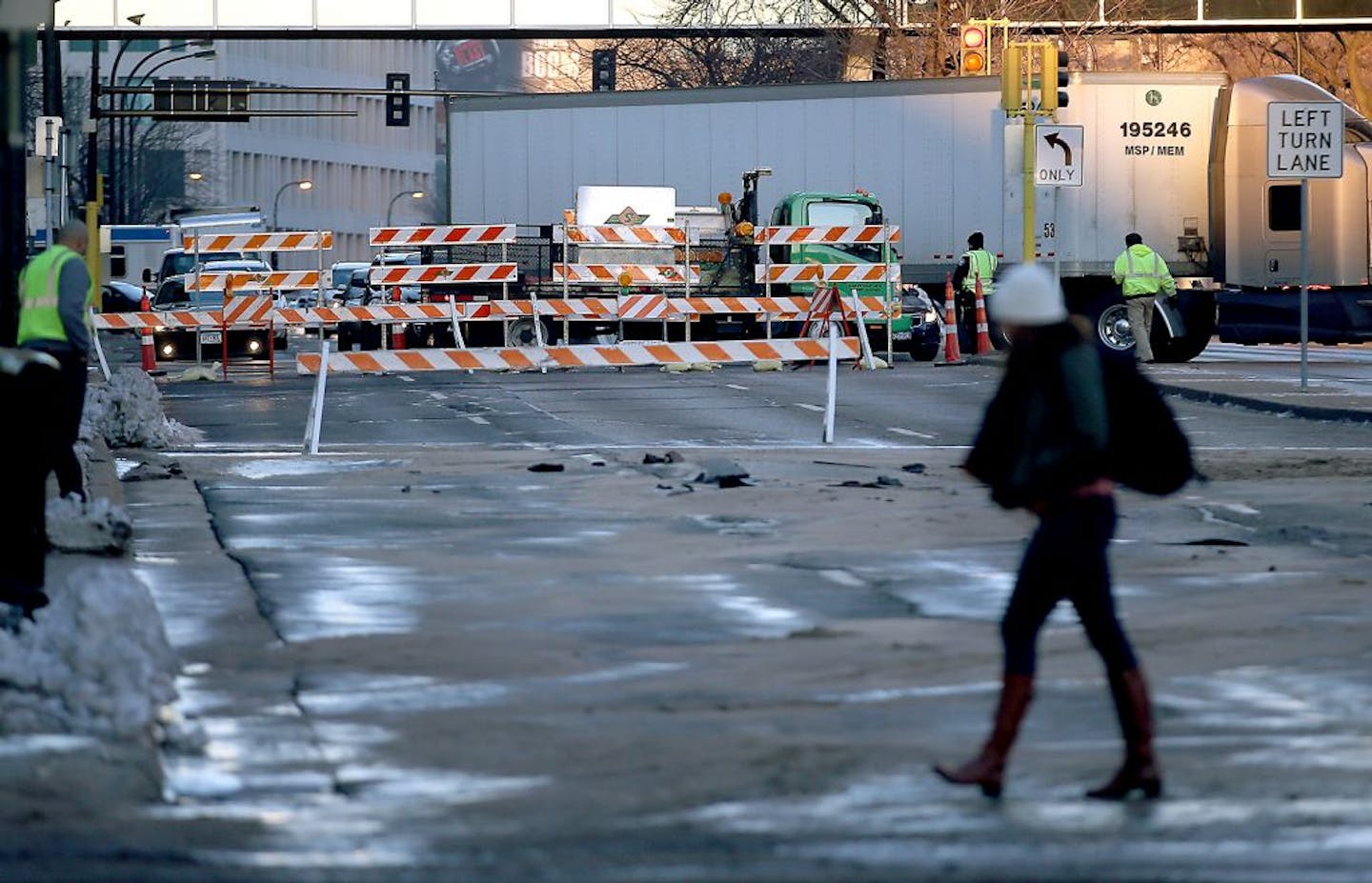 The street between S. 2nd Avenue and S. 3rd Avenue buckled after a water line break on Washington Avenue South, Friday, December 4, 2015 in downtown Minneapolis, MN.