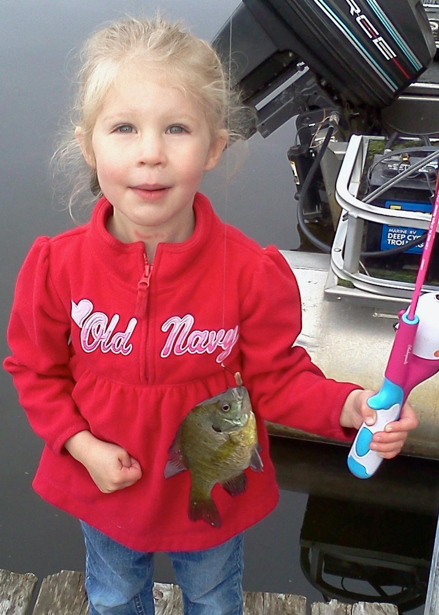 Author Bill Shogren's granddaughter, Grace, was plenty happy to catch this sunnie. Photo courtsey Bill Shogren