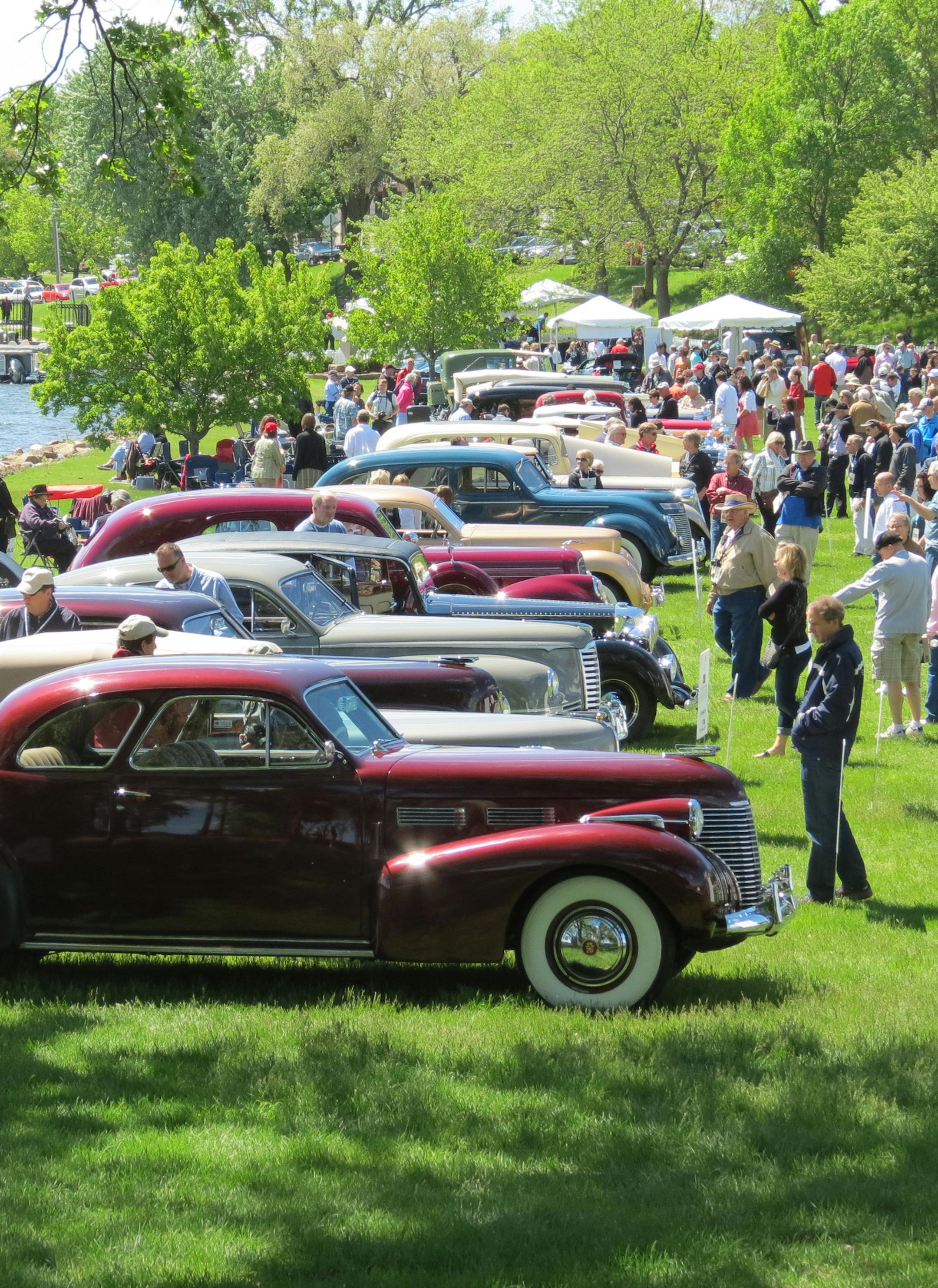 Lakeside with cars and crowd