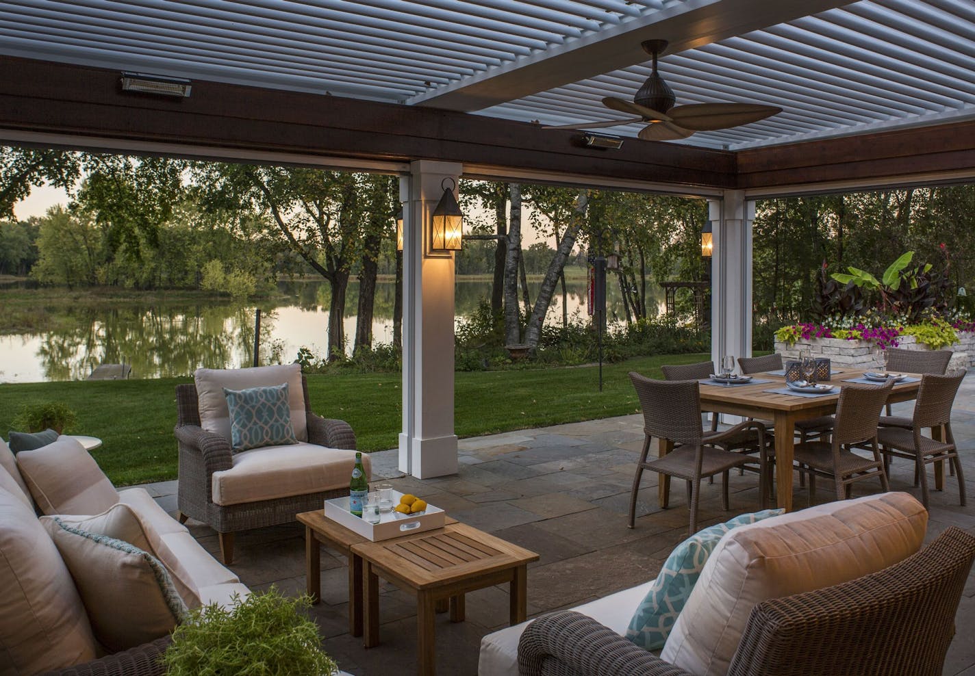 Downs Lake provided the backdrop and the challenge for this porch expansion, designed with a motorized roof and roll-down walls to comply with setback limits.