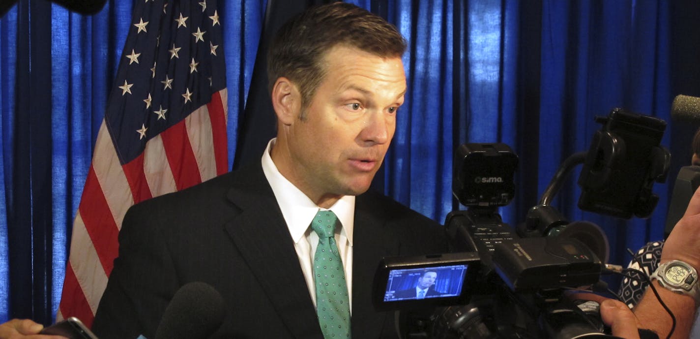 Kansas Secretary of State Kris Kobach speaks to supporters in launching his campaign for the Republican nomination for governor, Thursday, June 8, 2017, at an events center in Lenexa, Kan. Kobach has advised President Donald Trump on immigration and election fraud issues and is vice chairman of a presidential commission on voter fraud. (AP Photo/John Hanna) ORG XMIT: MIN2017070314393336