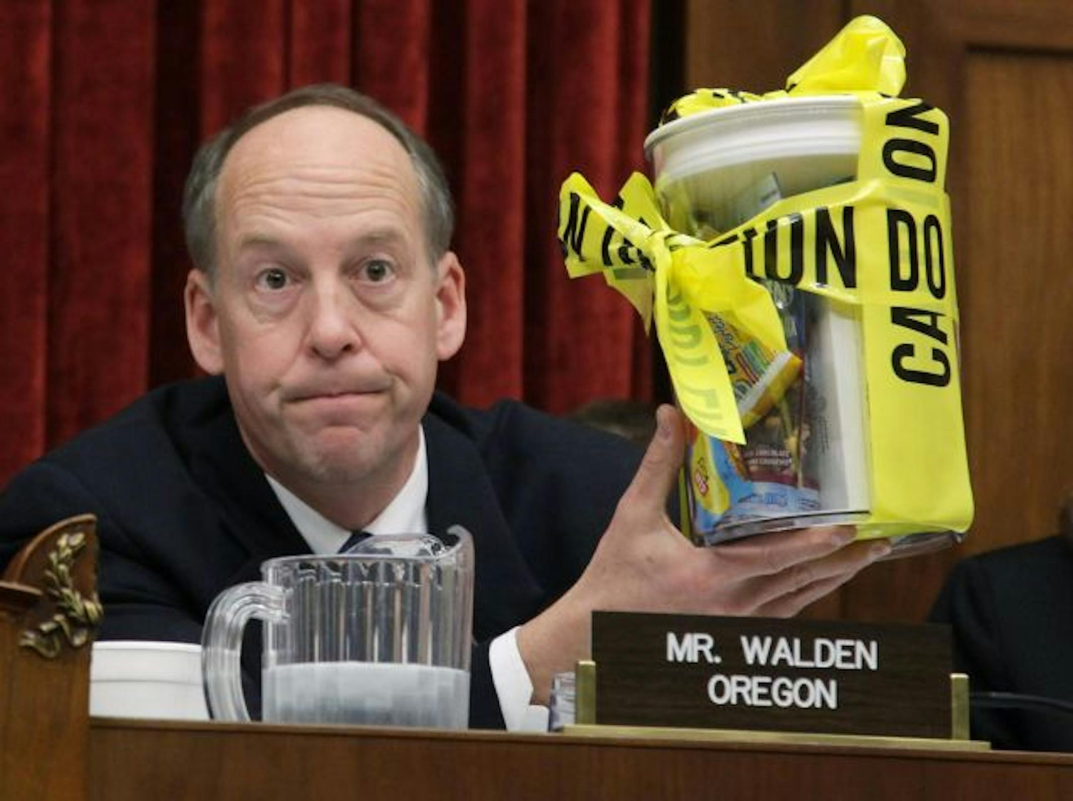 Rep. Greg Walden, R-Ore., held a container of recalled products wrapped in crime-scene tape as he questioned Stewart Parnell, owner and president of Peanut Corporation of America, who refused to answer questions during a House Energy and Commerce Committee hearing.