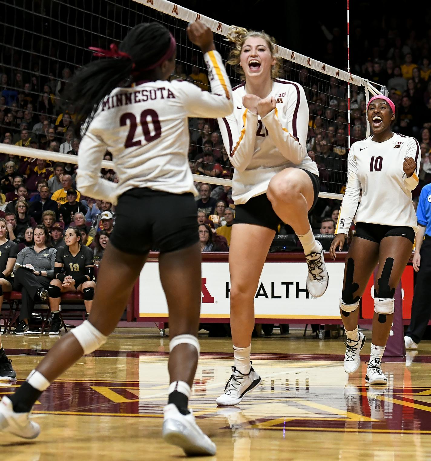 From left, Minnesota Golden Gophers outside hitter Adanna Rollins (20), middle blocker Regan Pittman (21) and right side hitter Stephanie Samedy (10) celebrated a point late in the third set as they closed in on a 3-0 victory over Purdue Saturday night. ] Aaron Lavinsky &#x2022; aaron.lavinsky@startribune.com The University of Minnesota Golden Gophers volleyball team played the Purdue Boilermakers on Saturday, Nov. 10, 2018 at the University of Minnesota Athletic Pavilion.