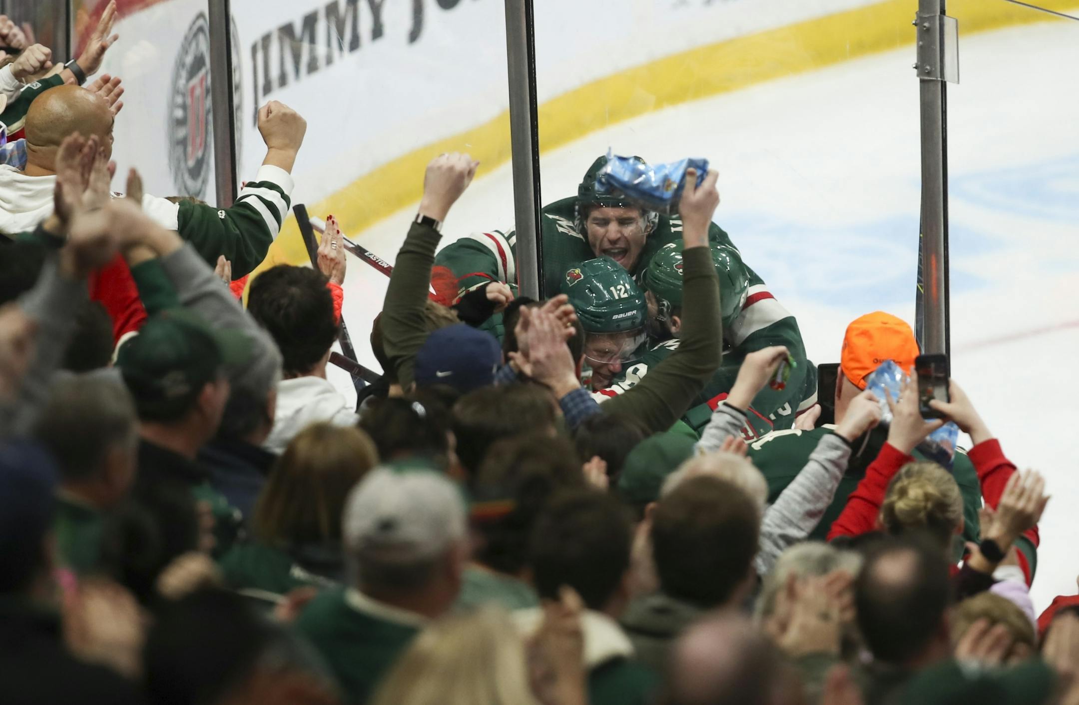 Minnesota Wild defenseman Jared Spurgeon was smothered by his teammates after he tied the game at 2-2 in the third period.