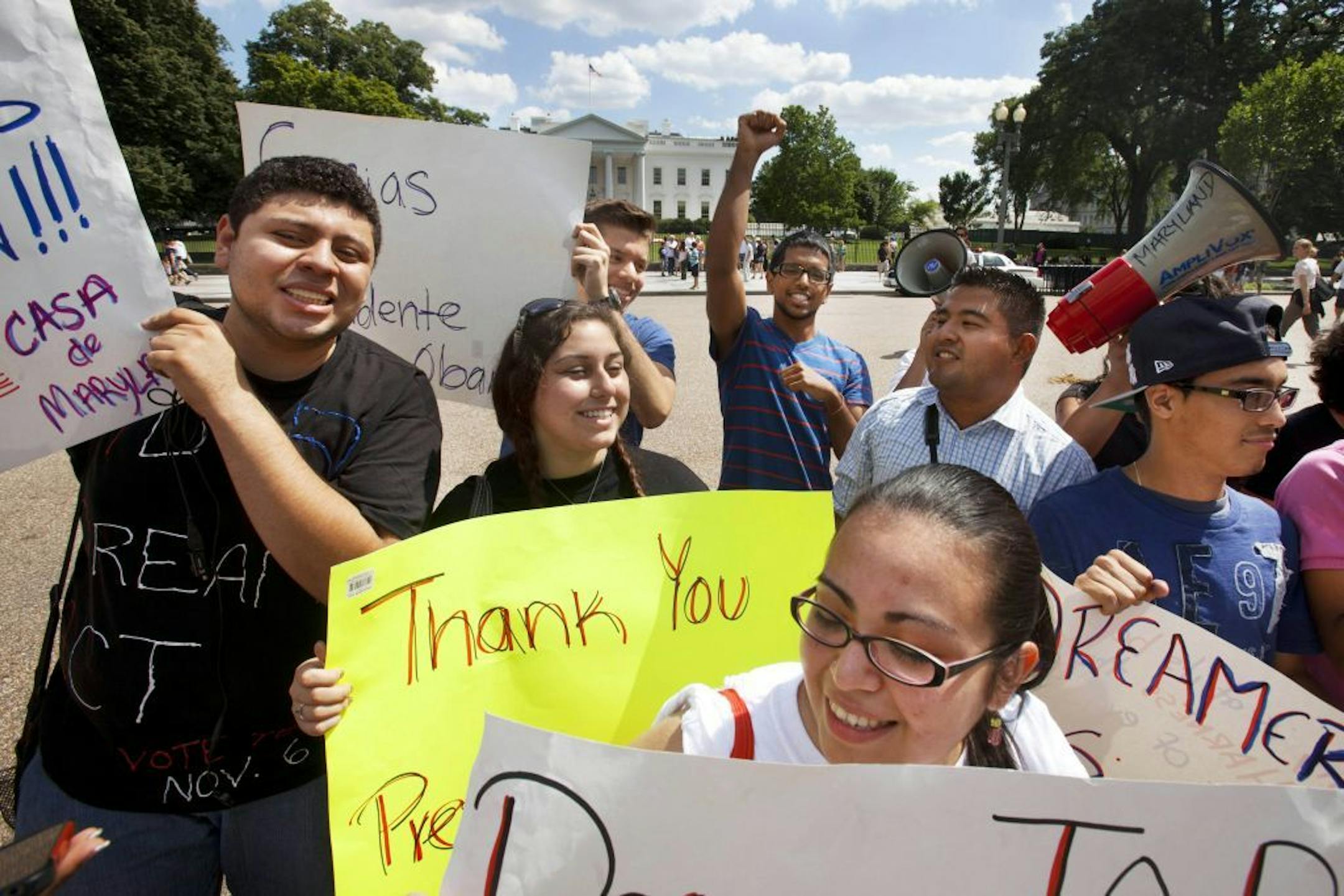 FILE - In this June 15, 2012 file photo, Ricky Campos, 23, of Silver Spring, Md., left, Katye Hernandez, 22, both illegal immigrants originally from El Salvador, who live in Silver Spring, Md., rallied outside the White House in support of the president's announcement that the U.S. government will stop deporting and begin granting work permits to younger illegal immigrants who were brought to the U.S. by their parents when they were children.