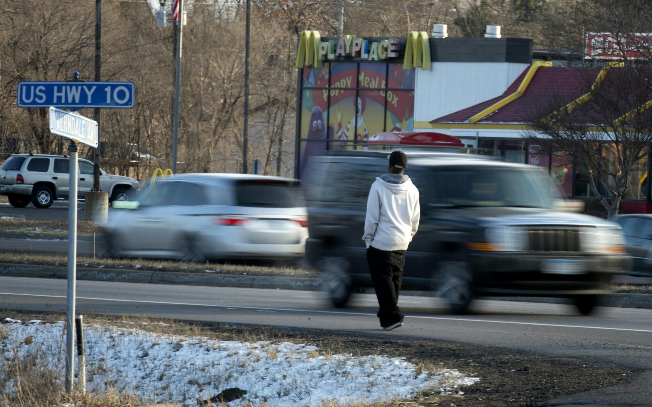 A pedestrian waited for an opportunity to cross busy Hwy. 10 in Anoka at Verndale Avenue near the spot where Hannah Craft, 16, was killed.