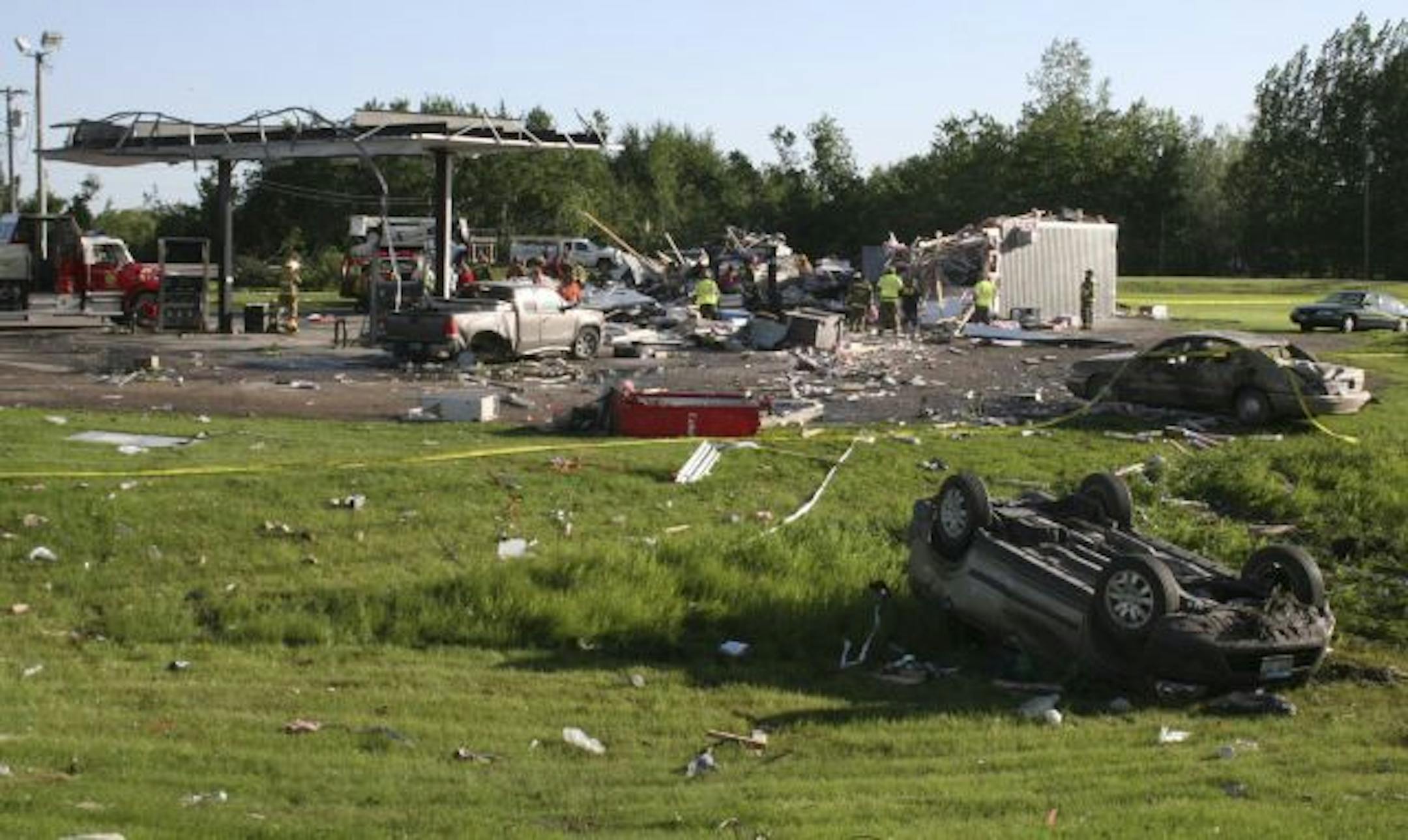 PHOTO BY CHRIS FEE/KROX. Cars and debris litter the area by the Mentor Convenience Store Thursday, June 17, 2010 in Mentor, Minn. A man was killed when the tornado hit the store.
