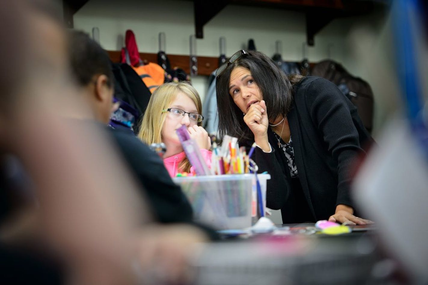 Minnesota Education Commissioner Brenda Cassellius sat in on a 6th grade math class at TrekNorth as students worked on solutions to math problems. First they worked on their own and then discussed solutions as a group with the help of small flip cards that equip students with the proper academic language to phrase their questions to each other instead of the casual language of friends.