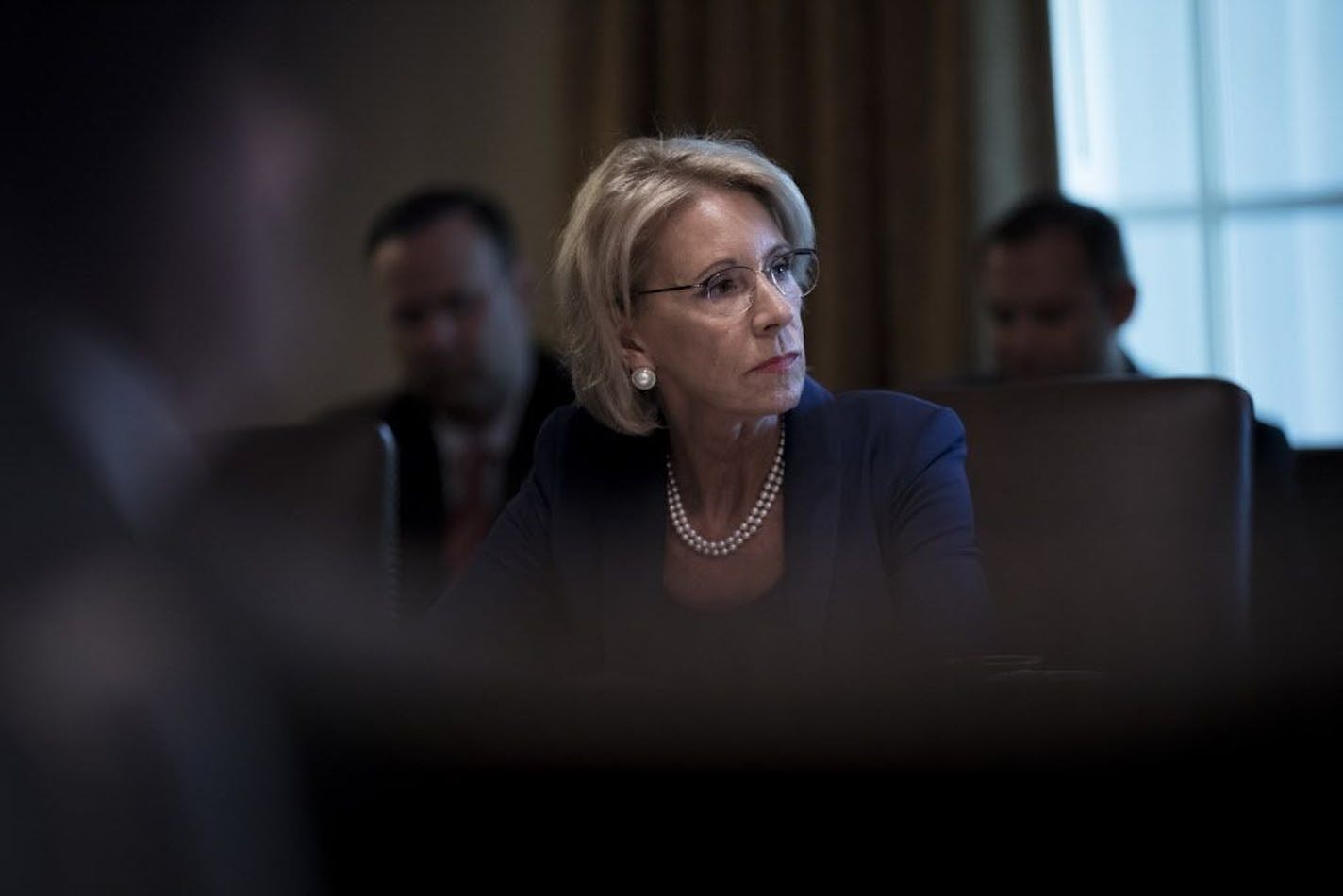 FILE -- Education Secretary Betsy DeVos attends a meeting at the White House on Aug. 16, 2018. DeVos said Tuesday that ballooning student debt has caused a "crisis in higher education."