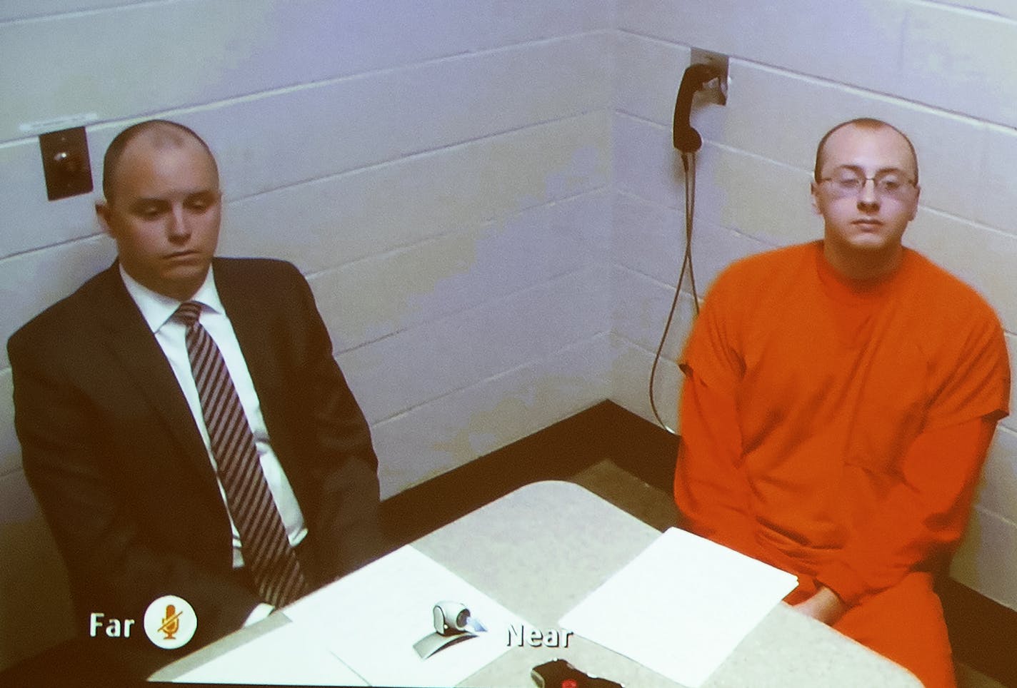 Jake Patterson appeared with one of his attorneys via video. Charging documents sat on the table.