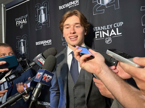 Macklin Celebrini, the expected No. 1 pick in the NHL draft to the San Jose Sharks, speaks with reporters during the Stanley Cup Finals in Sunrise, Fl
