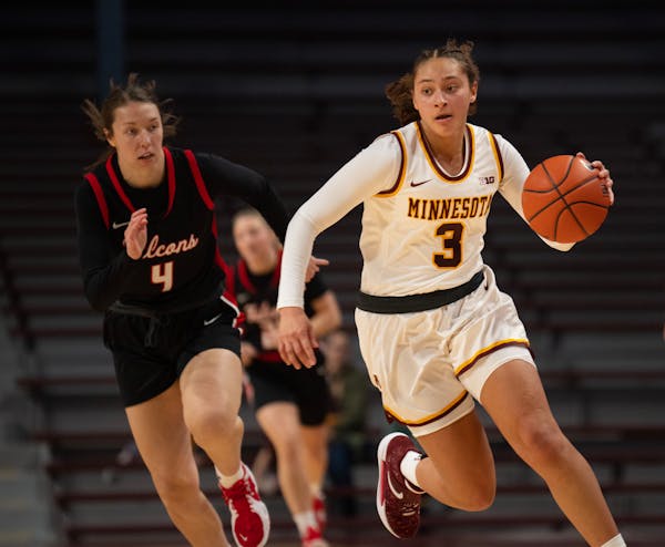 Gophers guard Amaya Battle, who drove with the ball Oct. 30 against Wisconsin-River Falls, had six points and nine assists in a season-opening victory