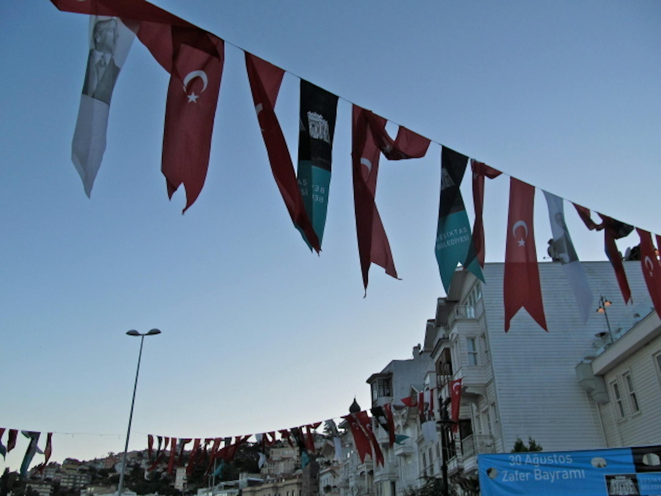 Turkish flags strung alongside the houses on the Bosphorus Strait.