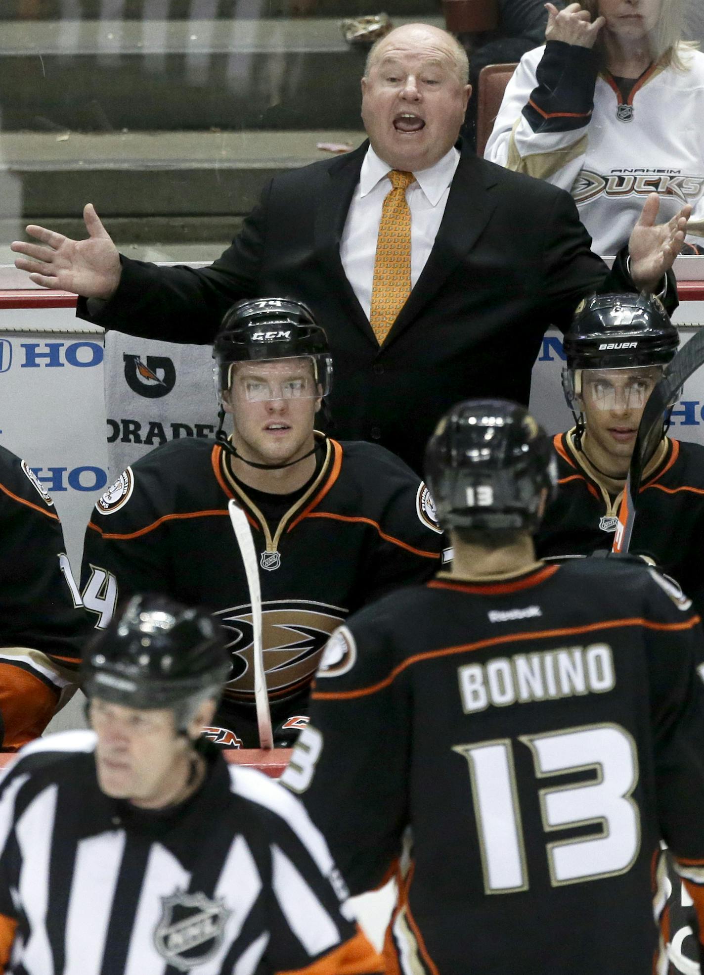 Anaheim Ducks coach Bruce Boudreau yells to a official during the third period of an NHL hockey game against the Vancouver Canucks in Anaheim, Calif., Friday, Jan. 25, 2013. (AP Photo/Chris Carlson) ORG XMIT: ANA113