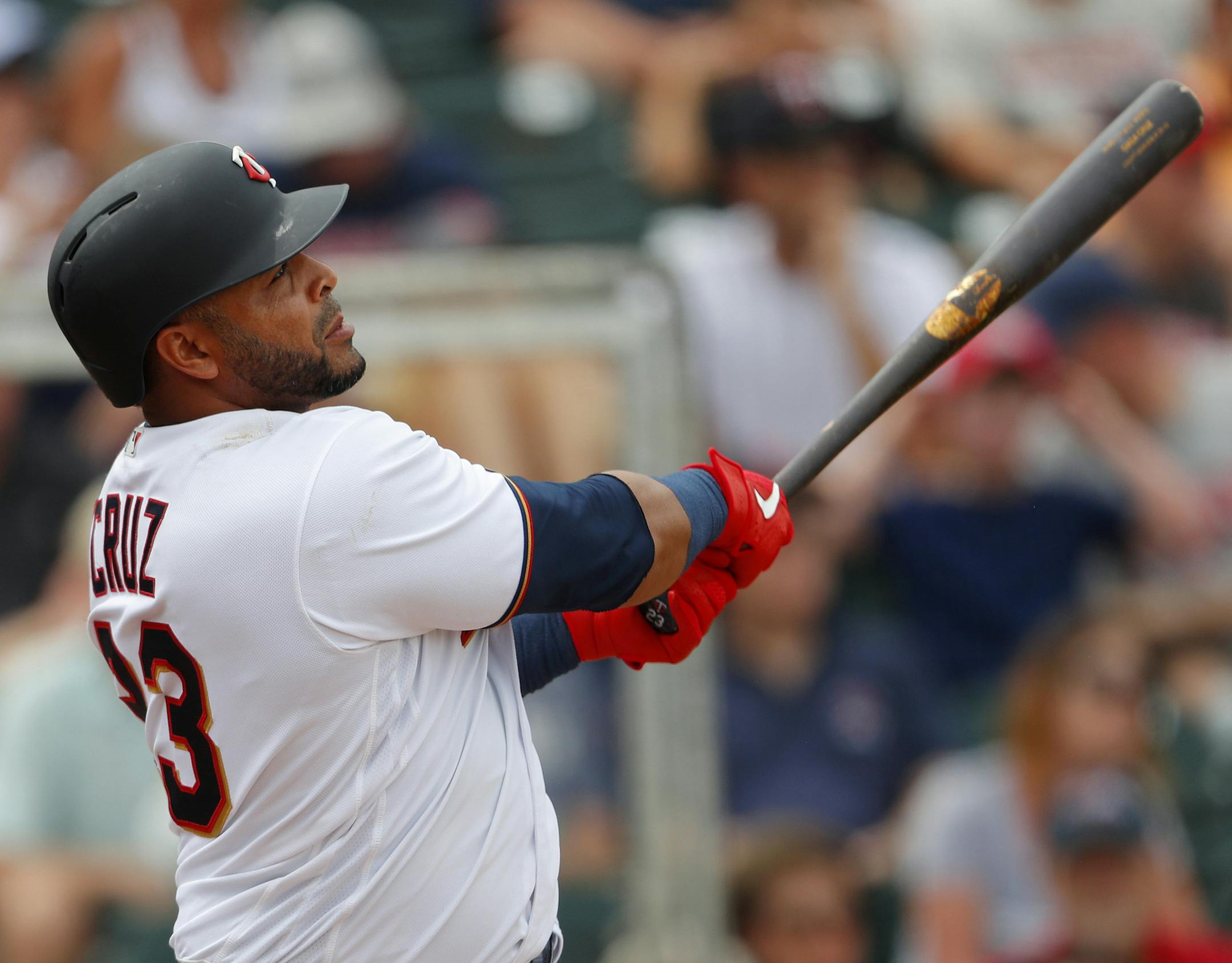 Minnesota Twins designated hitter Nelson Cruz drives in a run with a double in the fifth inning of a spring training baseball game against the Boston Red Sox, Monday, March 18, 2019, in Fort Myers, Fla. Minnesota won 4-1. (AP Photo/John Bazemore)