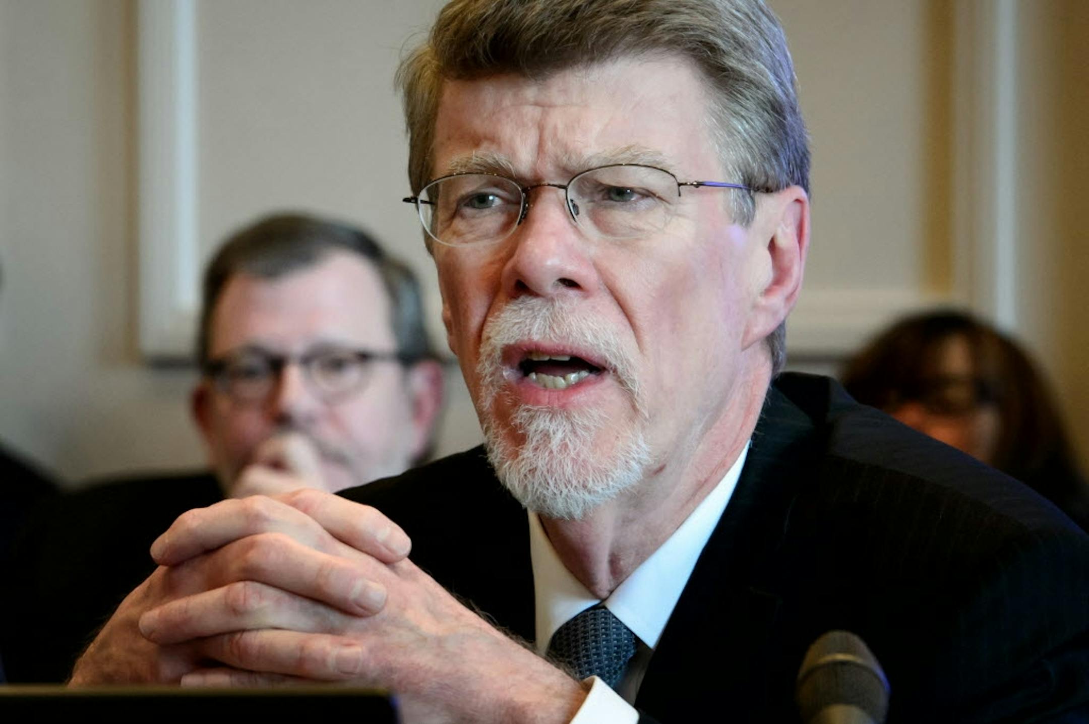 U of M President Eric Kaler, left, listened as State Auditor James Nobles delivered their report related to the death of Dan Markingson.