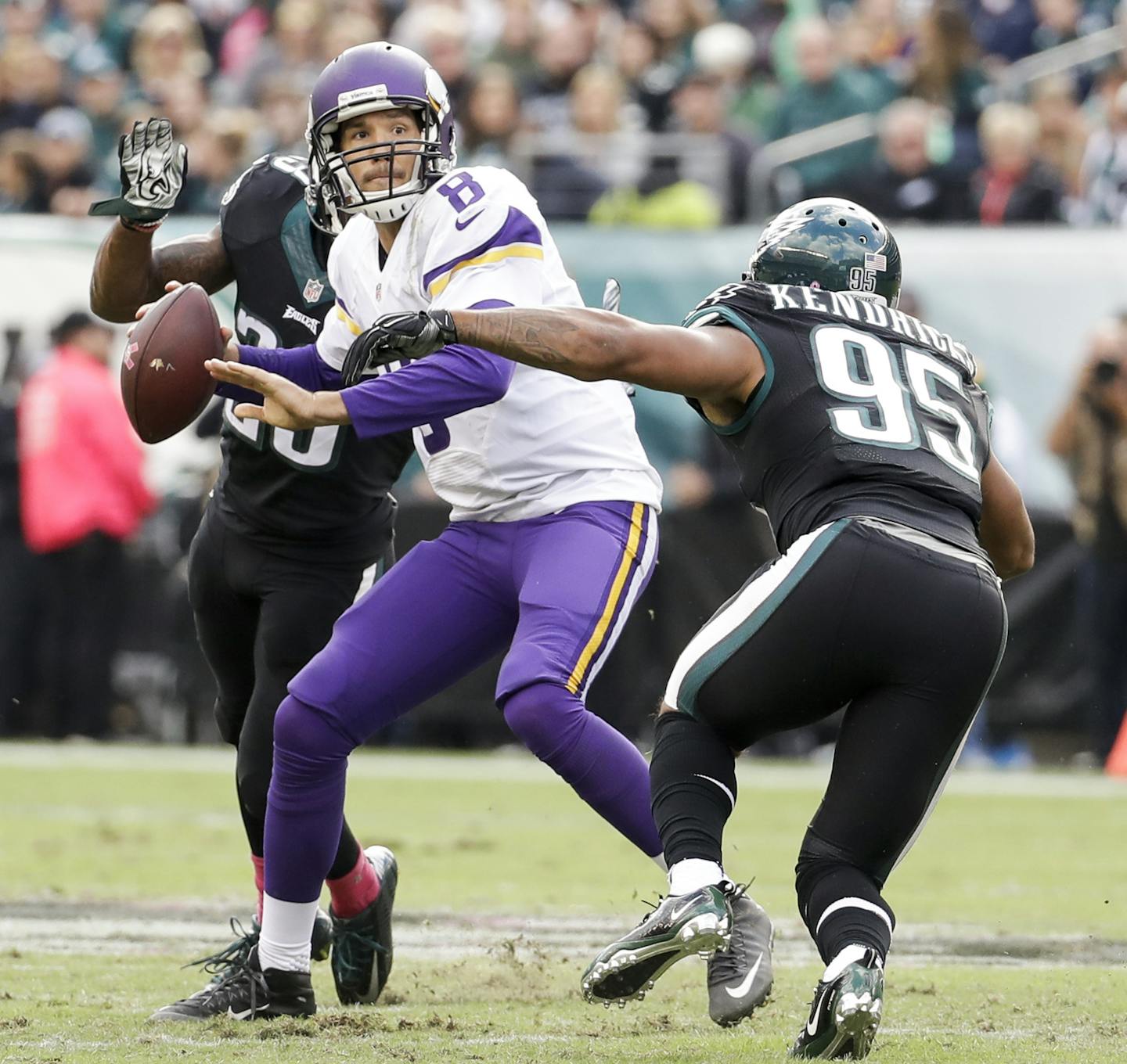 FILE - In this Oct. 23, 2016, file photo, Minnesota Vikings quarterback Sam Bradford (8) is shown under pressure by Philadelphia Eagles free safety Rodney McLeod (23) and outside linebacker Mychal Kendricks (95) during an NFL football game in Philadelphia. Minnesota's biggest weakness, the patched-together offensive line, was exposed in the team's first loss. (AP Photo/Chris Szagola, File)