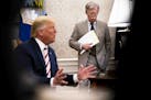 FILE -- John Bolton, then the national security adviser, watches as President Donald Trump hosts the Romanian president in the Oval Office, at the Whi