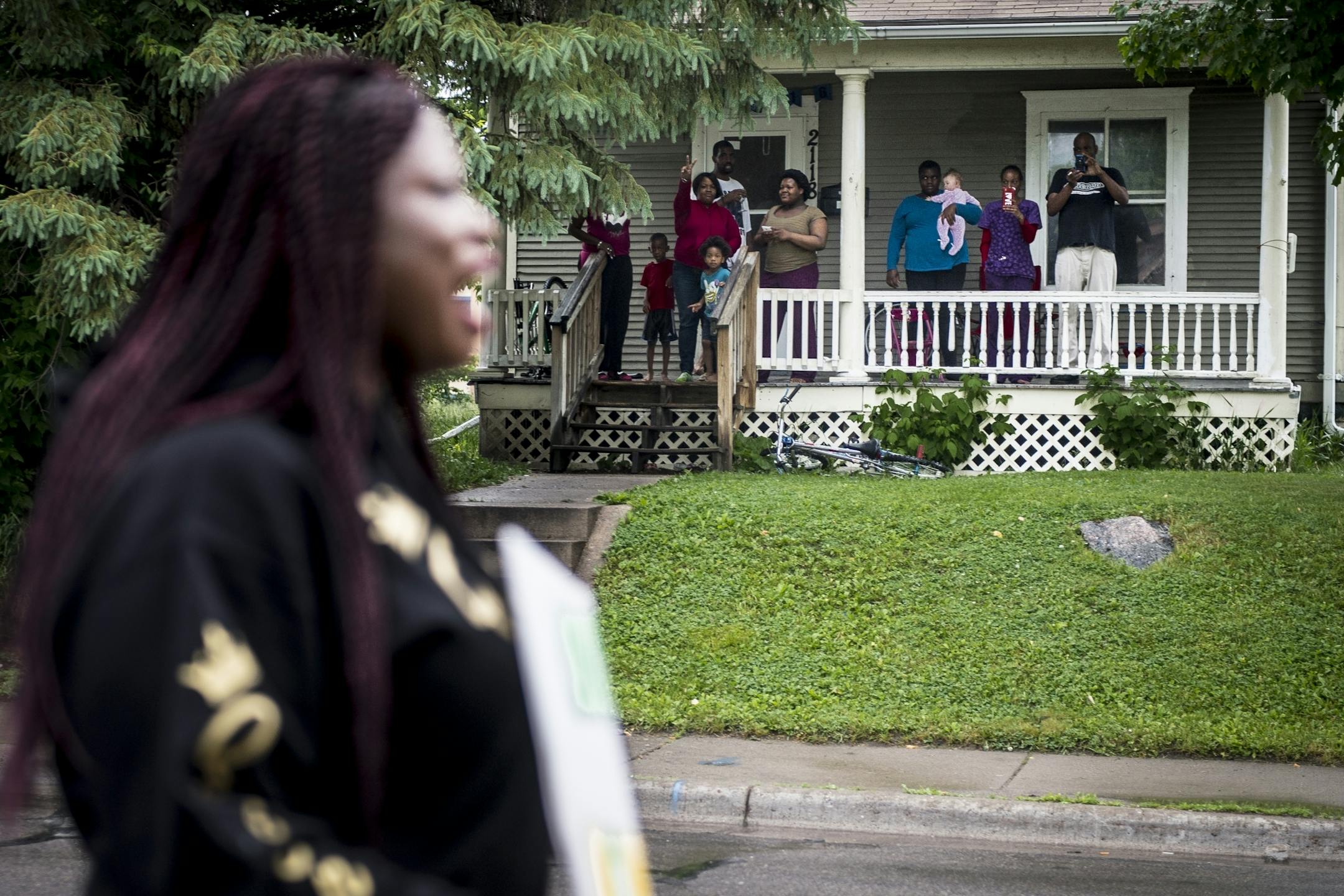 Northside residents watched as demonstrators, including Minneapolis NAACP President Nekima Levy-Pounds, took part in a peace walk to the site of Thursday night's fatal shooting of 59-year-old Birdell Beeks.