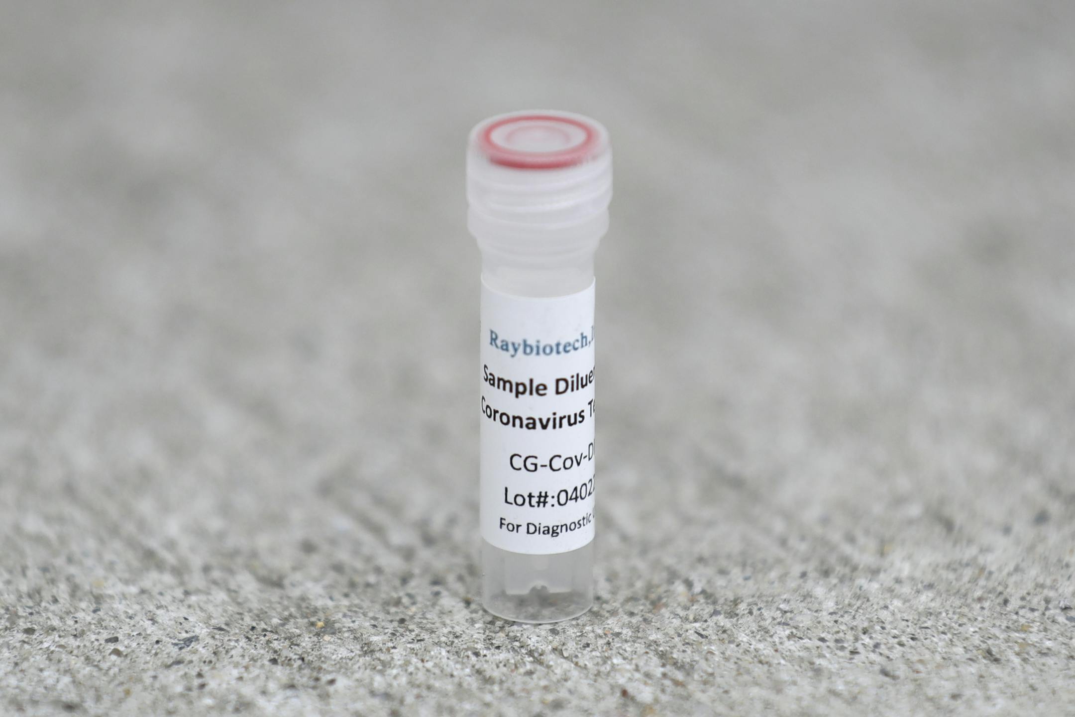 A piece of an antibody test kit is seen at a drive through testing site in Hempstead, N.Y., Tuesday, April 14, 2020. The test, being administered by Somos Community Care, takes approximately 15 minutes and tests for the presence of antibodies in a person's blood, signifying that they may have some immunity to the coronavirus. (AP Photo/Seth Wenig)