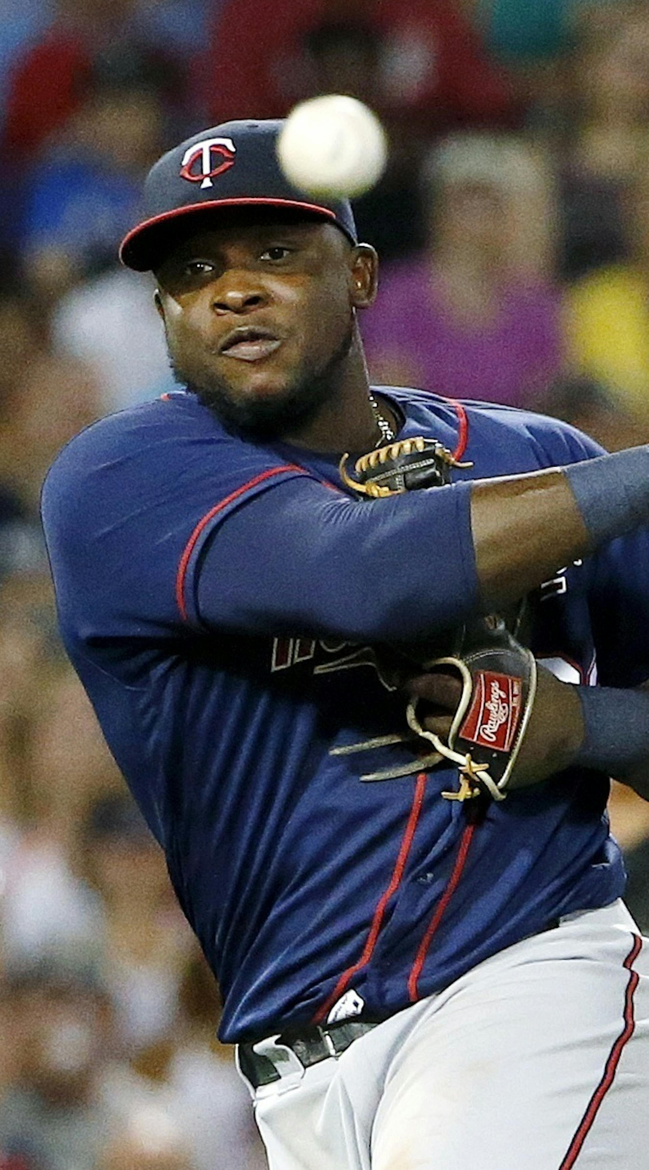 Minnesota Twins' Miguel Sano throws to first base on an infield single by Boston Red Sox's Jackie Bradley Jr. during the sixth inning of a baseball game in Boston, Saturday, July 23, 2016. Sano's throwing error allowed Xander Bogaerts to score. (AP Photo/Michael Dwyer)
