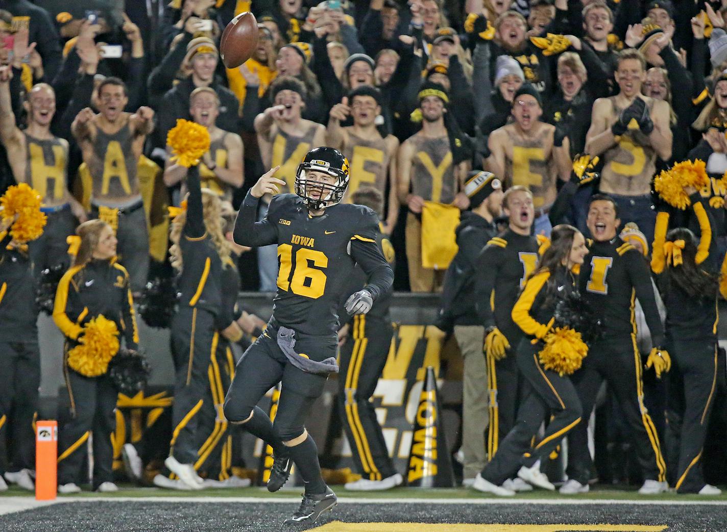 Iowa's quarterback C.J. Beathard flipped the ball in the air after running it in for a touchdown in the second quarter as Minnesota took on Iowa at Kinnick Stadium, Saturday, November 14, 2015 in Iowa City, IA. ] (ELIZABETH FLORES/STAR TRIBUNE) ELIZABETH FLORES &#x2022; eflores@startribune.com