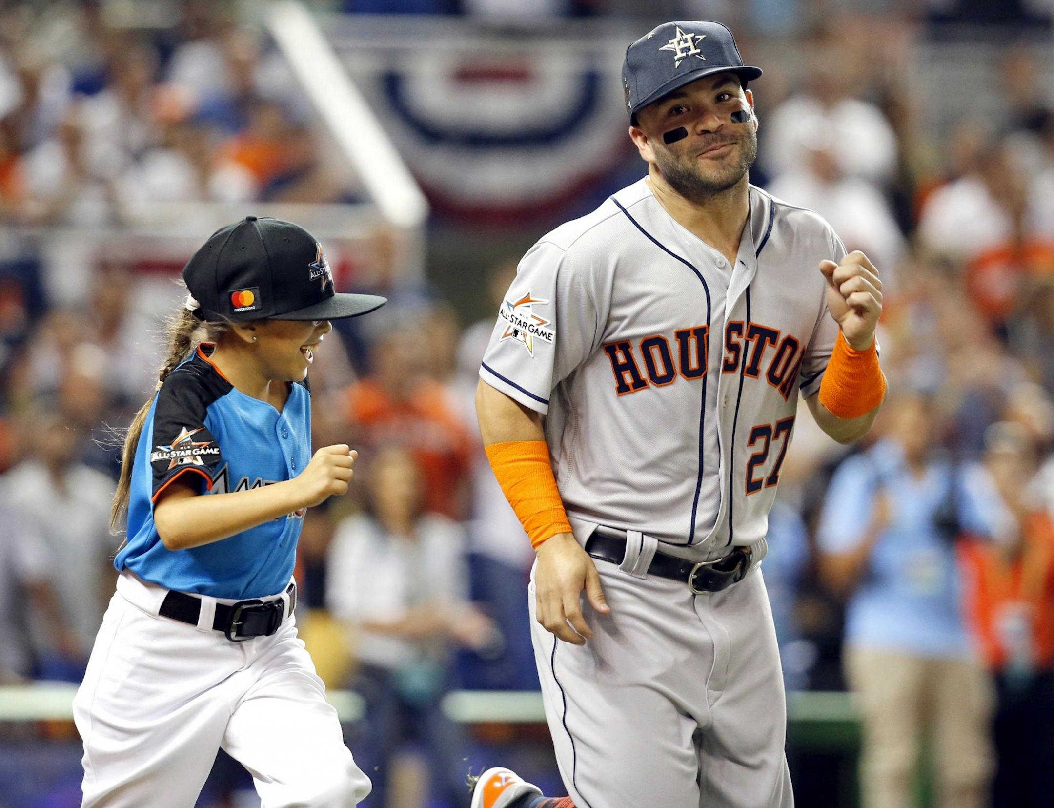 Houston Astros' Jose Altuve (27) runs out onto the field before the start of the MLB All-Star Game on Tuesday, July 11, 2017, at Marlins Park in Miami, Fla.