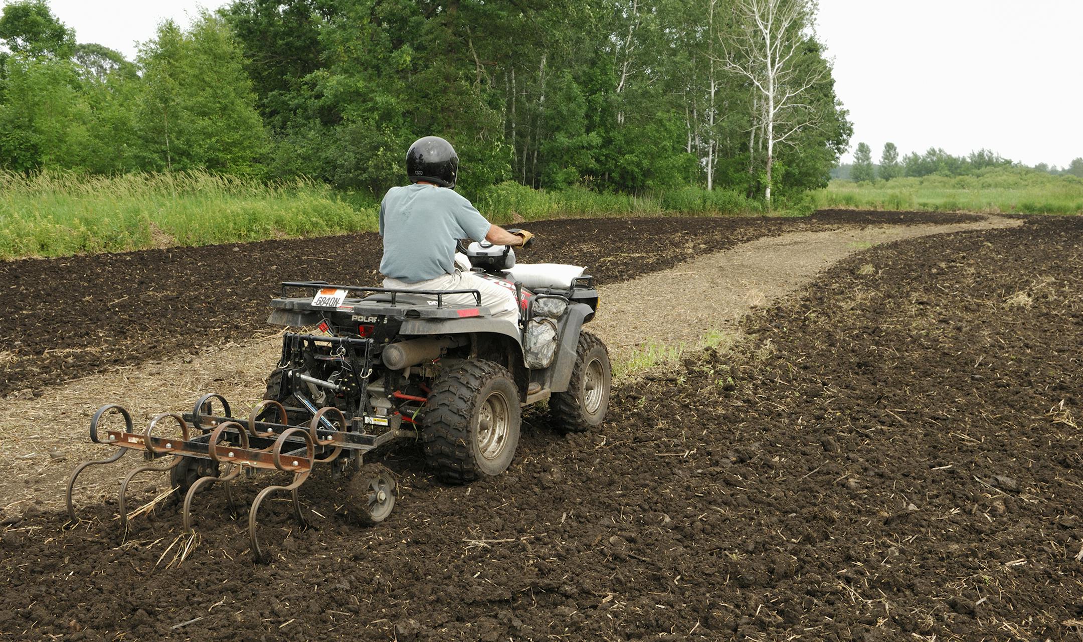 DO NOT USE. ONE-TIME USE WITH BILL MARCHEL COPY ONLY. Photo by Bill Marchel. Many implements are available to convert ATVs into tools for land management.