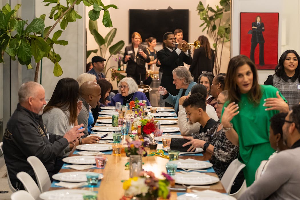 Attendees at Stories Behind the Menu are asked to sit with people they don’t already know. Second from right is ModernWell CEO Julie Burton (in green), who helped launch the program.