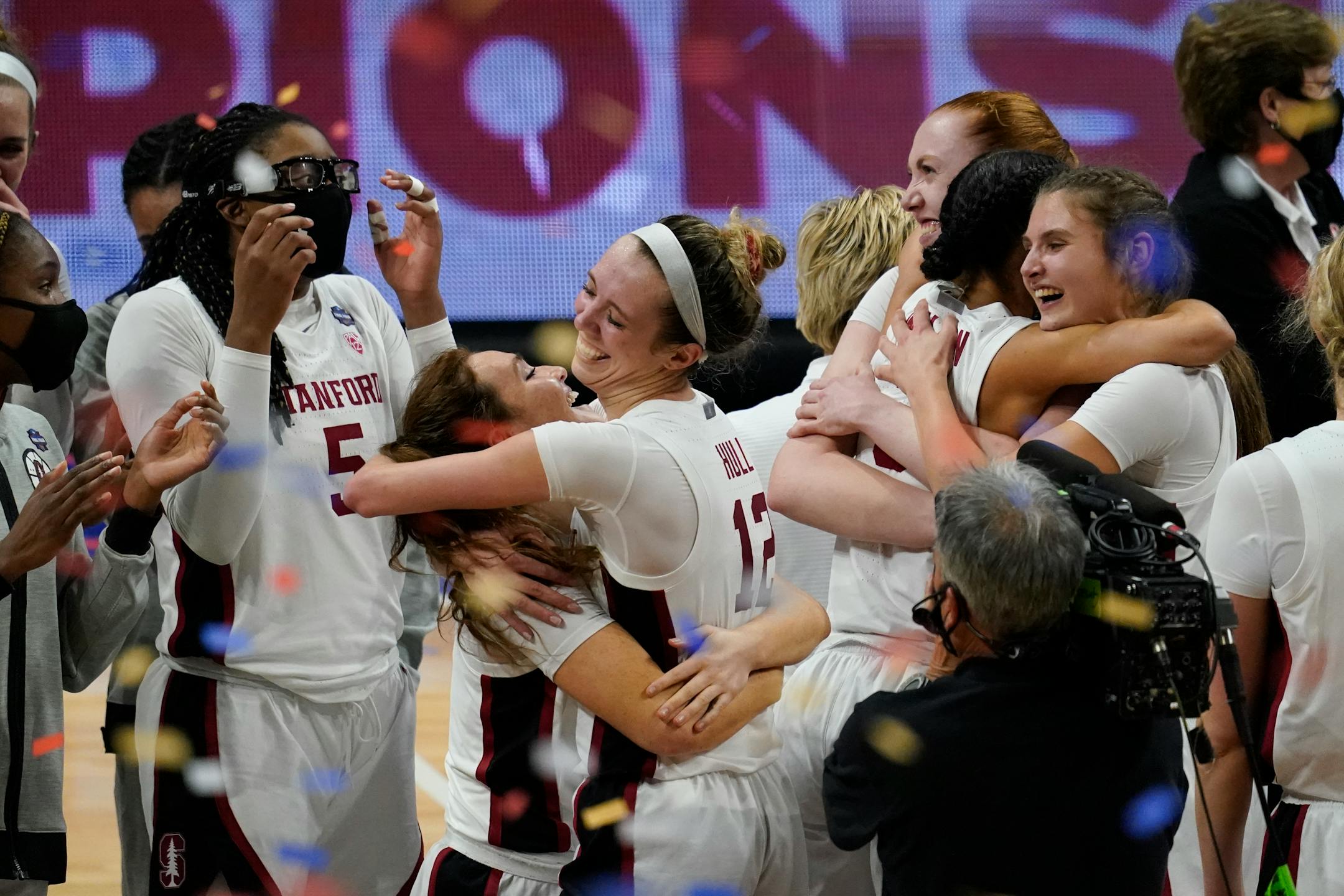 Stanford players celebrate at the end of the championship game against Arizona in the women's Final Four NCAA college basketball tournament, Sunday, April 4, 2021, at the Alamodome in San Antonio. Stanford won 54-53. (AP Photo/Eric Gay)