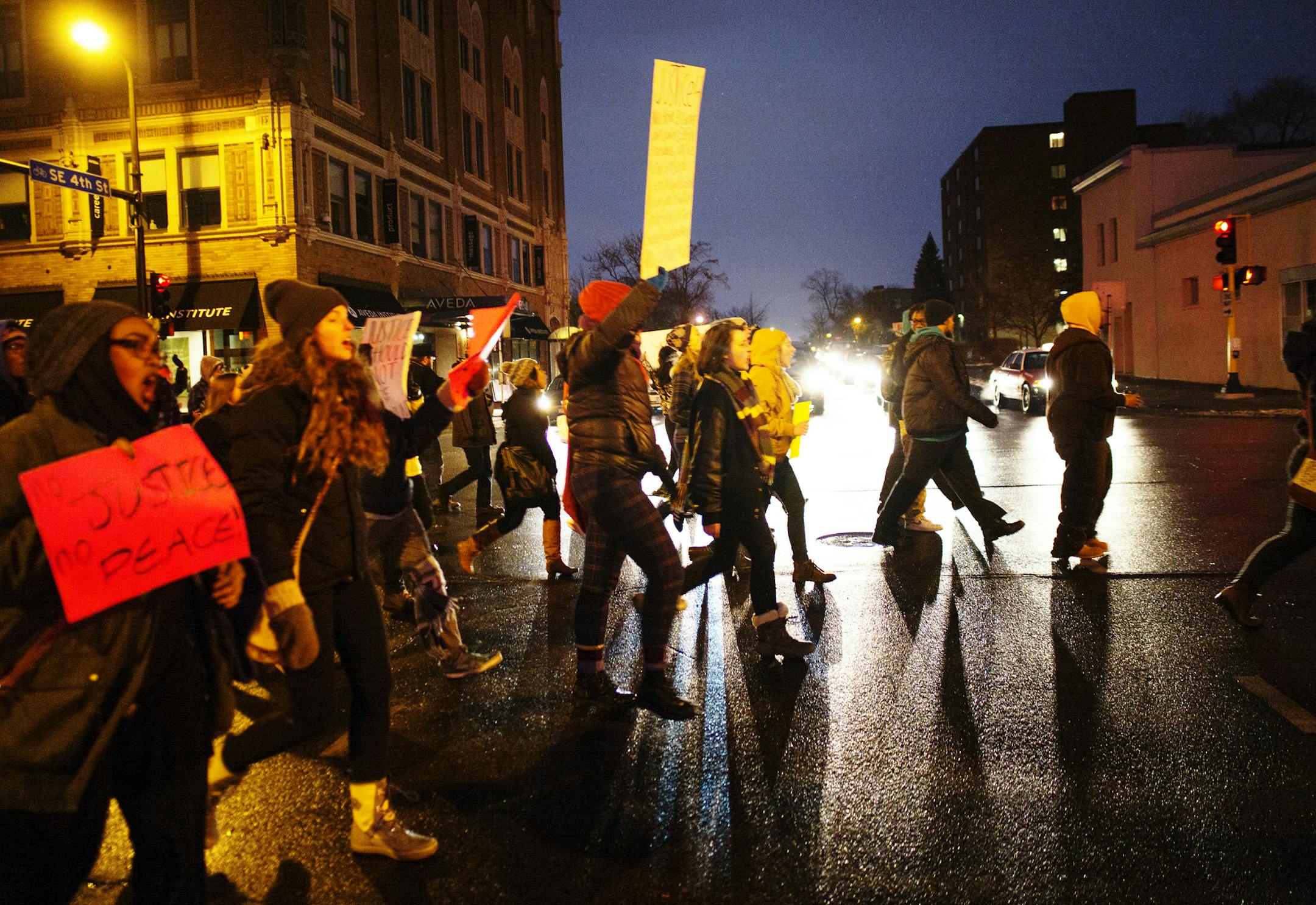 Activist Sabra Wazwaz led protesters through downtown with chants of "I can't breathe" and "Hands up, don't shoot."]In downtown Minneapolis, about 150 people turned out to protest police brutality. They marched from the Central Library across the Hennepin Bridge and back to the library across the 3rd Ave Bridge while staging a "die in" at Hennepin County Government Plaza .]Richard Tsong-Taatarii/ rtsong- taatarii@startribune.com