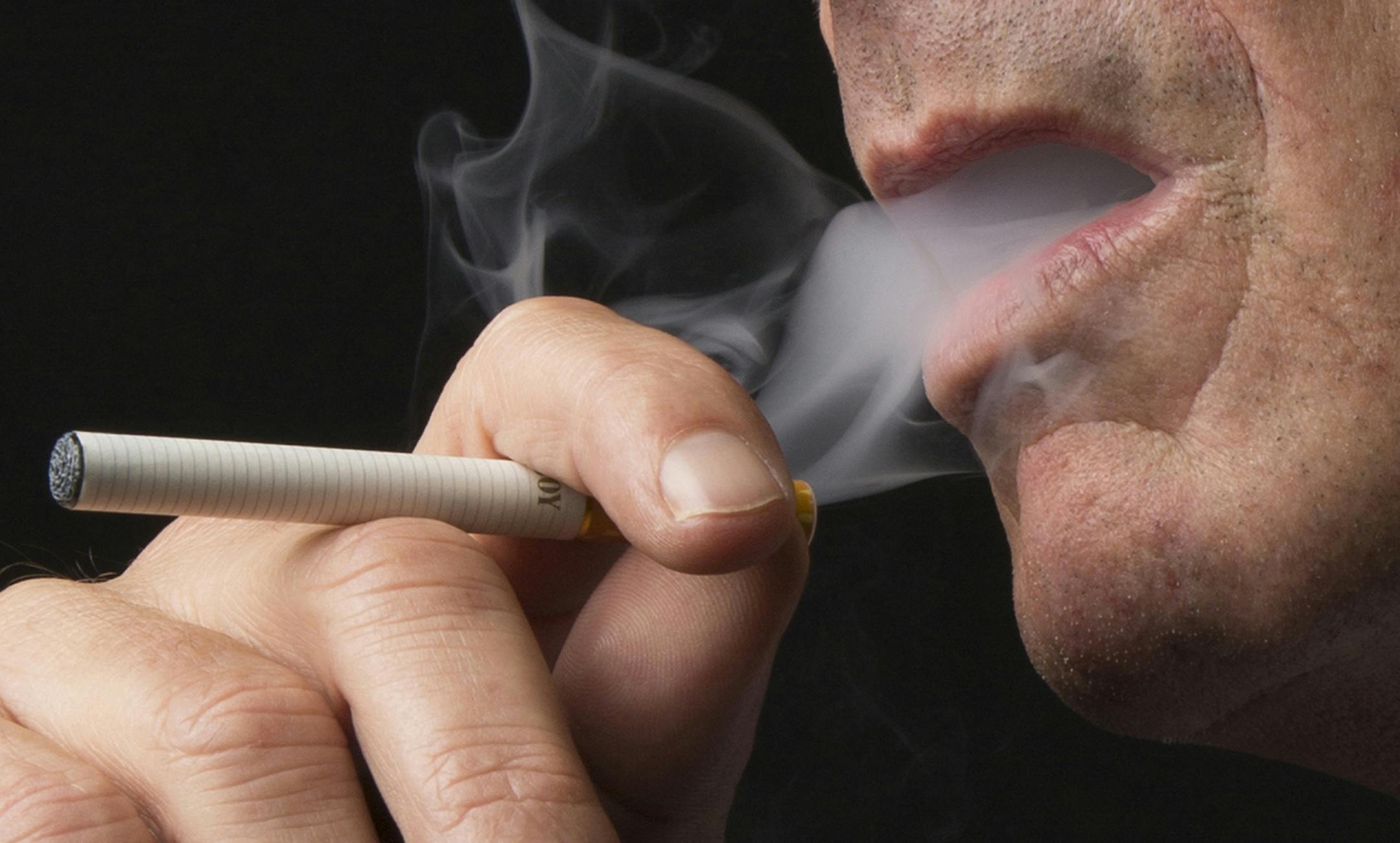 Geoff Vuleta, chief marketing officer at NJOY, samples the brand's King series e-cigarette in New York, Oct. 18, 2013. With its electronic cigarette, NJOY aims to bring smokers in from the cold, but faces a battle from health officials and big tobacco companies, which want in on the business, too. (Fred R. Conrad/The New York Times) -- PHOTO MOVED IN ADVANCE AND NOT FOR USE - ONLINE OR IN PRINT - BEFORE OCT. 27, 2013. -- ORG XMIT: MIN2013120911080852 ORG XMIT: MIN1312091137510250