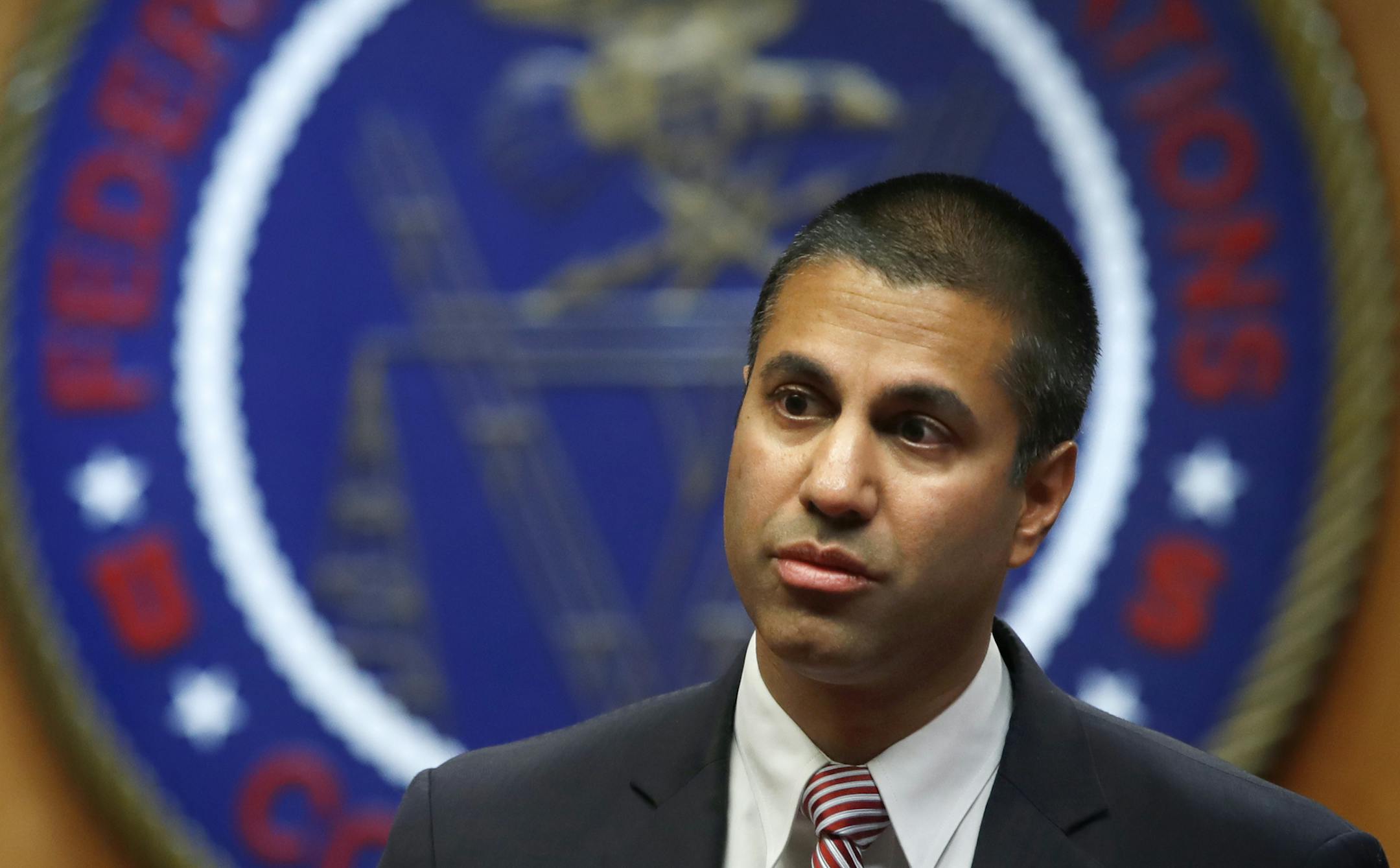 Federal Communications Commission (FCC) Chairman Ajit Pai arrives for an FCC meeting where they will vote on net neutrality, Thursday, Dec. 14, 2017, in Washington. (AP Photo/Jacquelyn Martin)