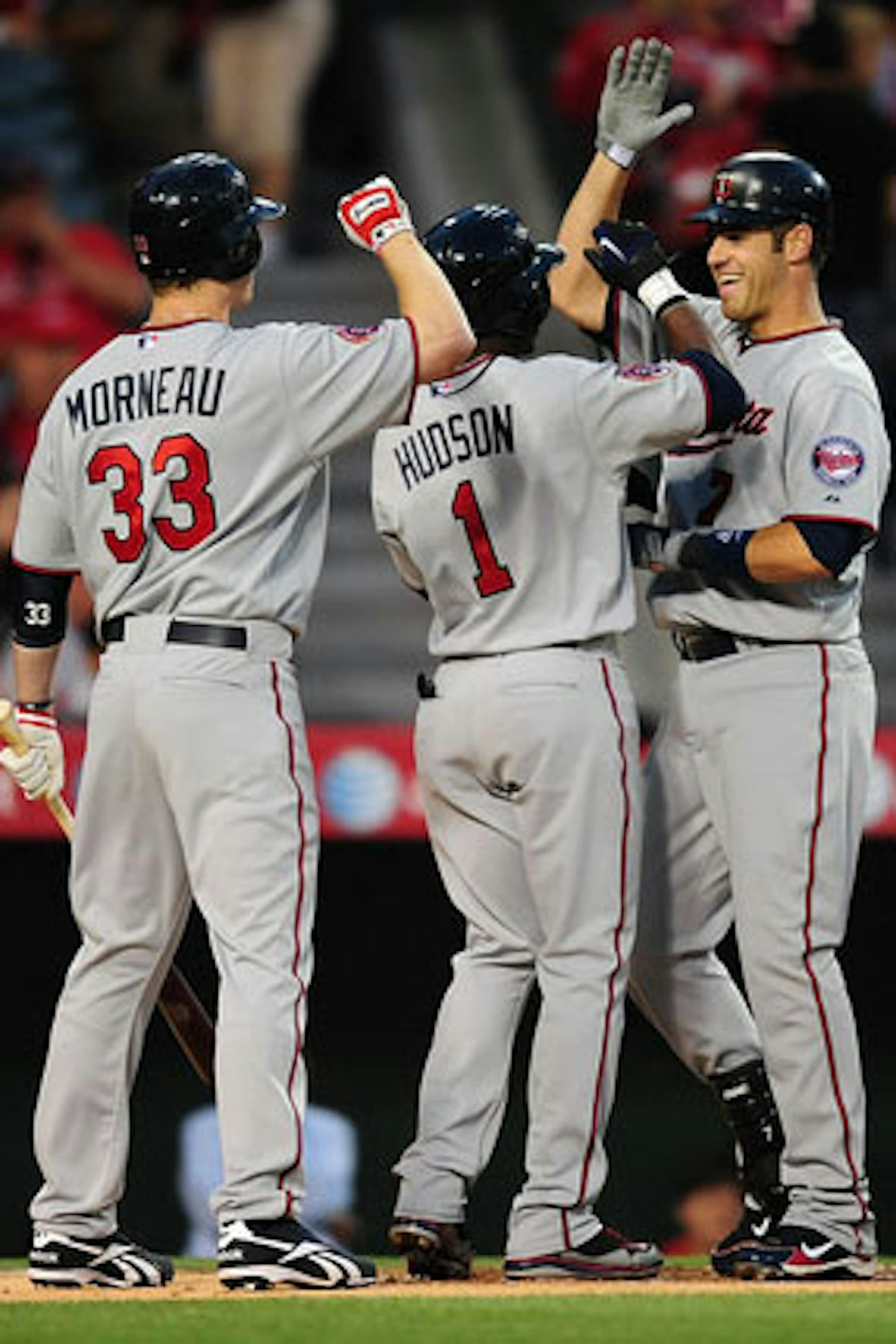 ANAHEIM, CA - APRIL 06:  Joe Mauer #7 of the Minnesota Twins celebrates after hitting a two run homerun in the first inning against the Los Angeles Angels of Anaheim on April 6, 2010 at the Angel Stadium of Anaheim in Anaheim, California.  (Photo by Jacob de Golish/Getty Images)