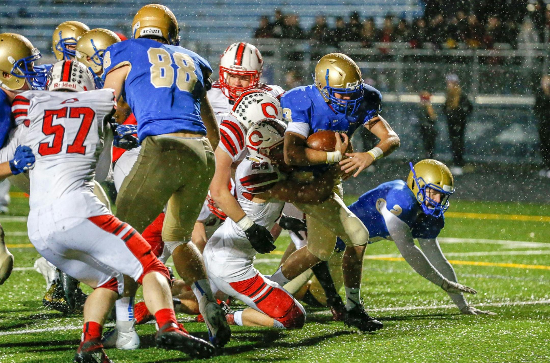 Wayzata running back Bennett Fragomeni scores the first of his three first half touchdowns against Centennial on Friday night. The Trojans led the Cougars 35-0 at halftime. Photo by Jeff Lawler, SportsEngine