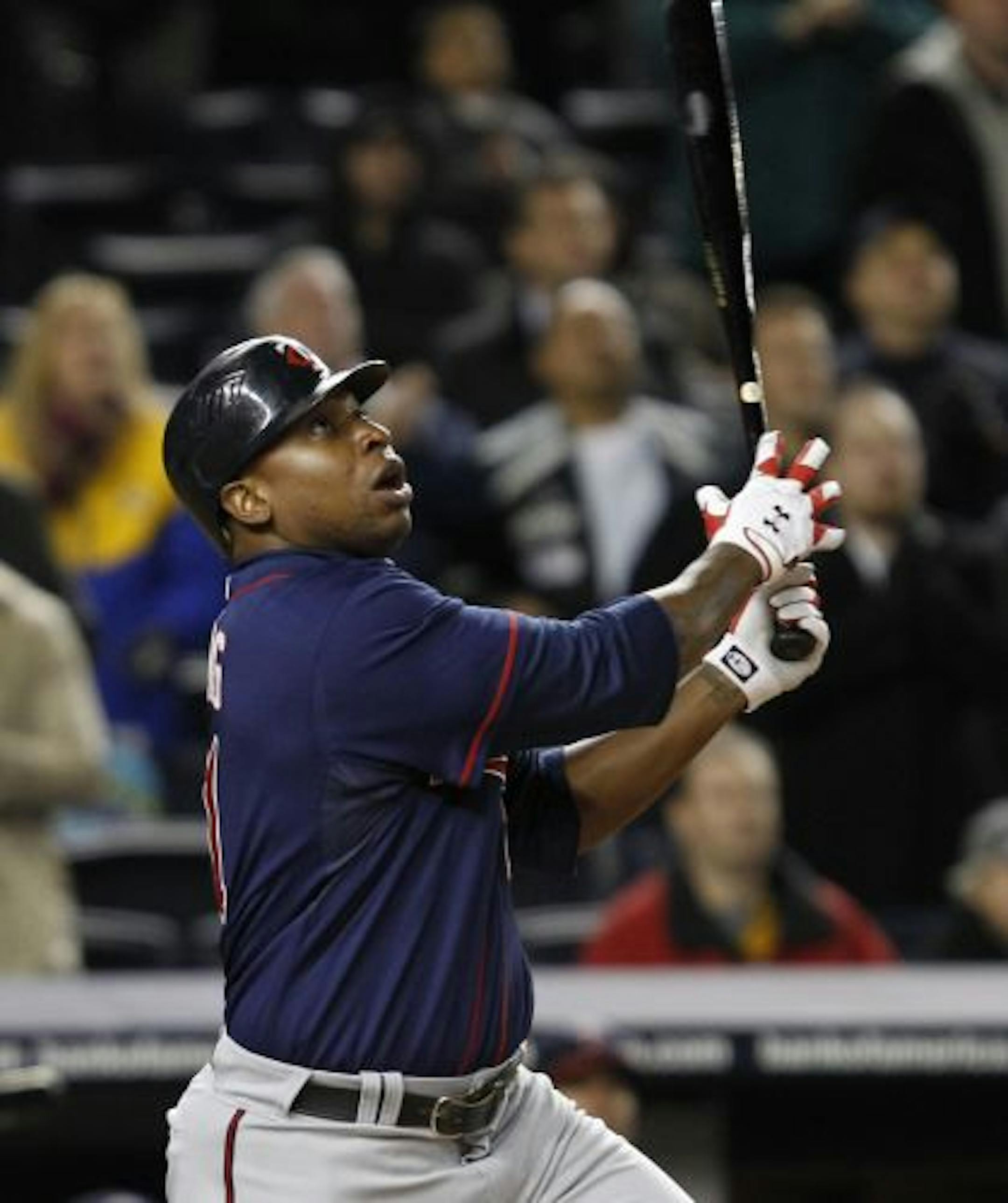Delmon Young's bloop double scored three runs in the eighth inning to tie the score.
