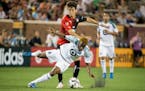 Minnesota United&#xd5;s Kevin Molino and Atlas&#xd5; Javier Salas fight for the ball during the second half on Saturday, July 15, 2017, at TCF Bank St