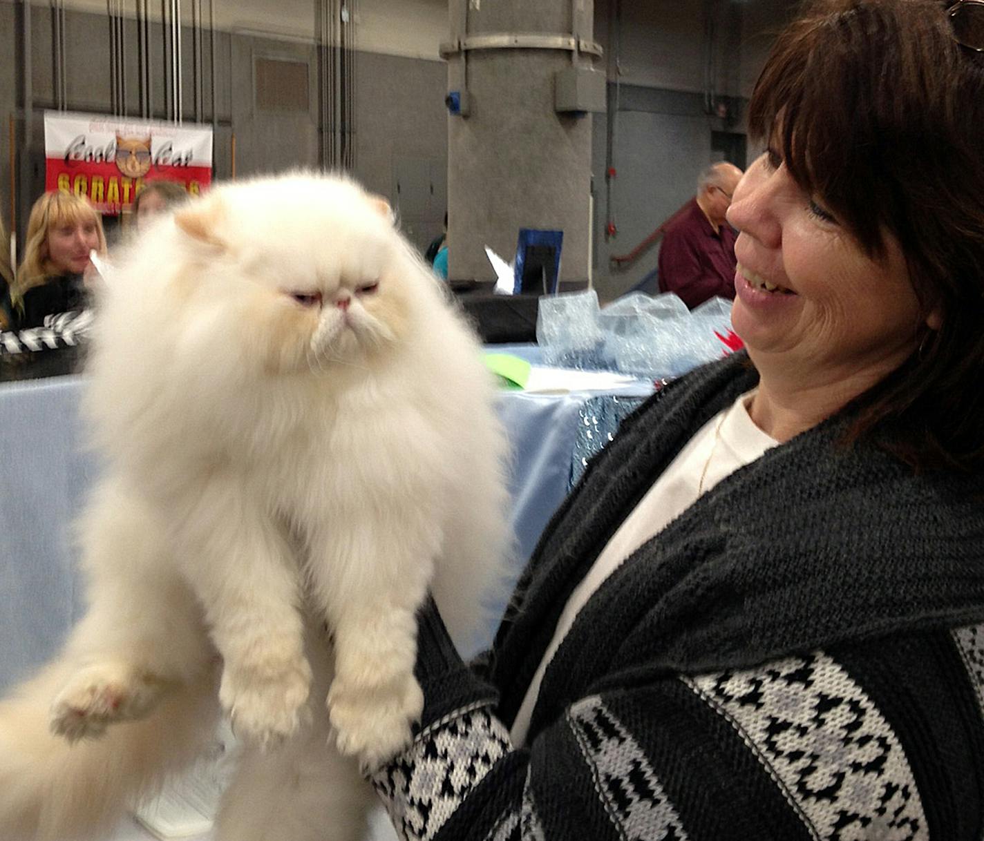 Marsha Tjeerdsma, of Springfield, S.D., gives an approving look to her Himalayan kitten, named "Easy Rider," at the Saintly City Cat Show in St. Paul on Saturday. Star Tribune photo by Allie Shah