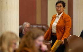 Rep. Kaohly Vang Her, DFL, St. Paul, walks from her desk as house members debated the higher education bill Monday, June 9, 2025, at the State Capitol