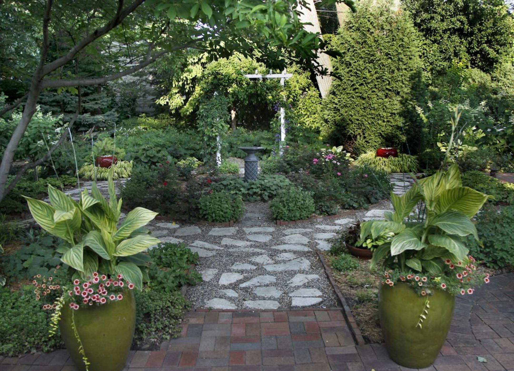Beverly Moore�s garden expands he backyard and along both neighbors yards. [ TOM WALLACE � twallace@startribune.com _ Assignment #20019050A_August 8, 2011_ SLUG: Garden1109 _ EXTRA INFORMATION: CQ by reporter, reflecting pool is right out her back door.