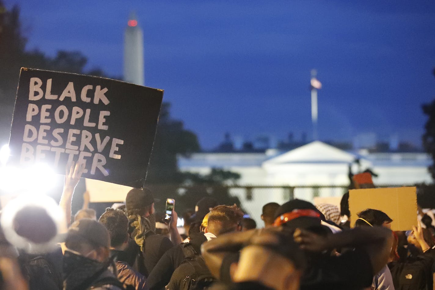 Demonstrators gather to protest the death of George Floyd, Tuesday, June 2, 2020, near the White House in Washington. Floyd died after being restrained by Minneapolis police officers. (AP Photo/Alex Brandon)