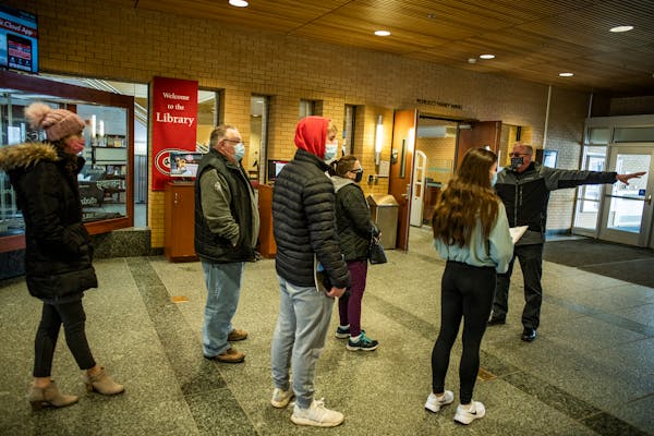 Admissions counselor John Brown gives a campus tour in St. Cloud, Minn., on Monday, March 14, 2022. Declining enrollment could bode ill for colleges l