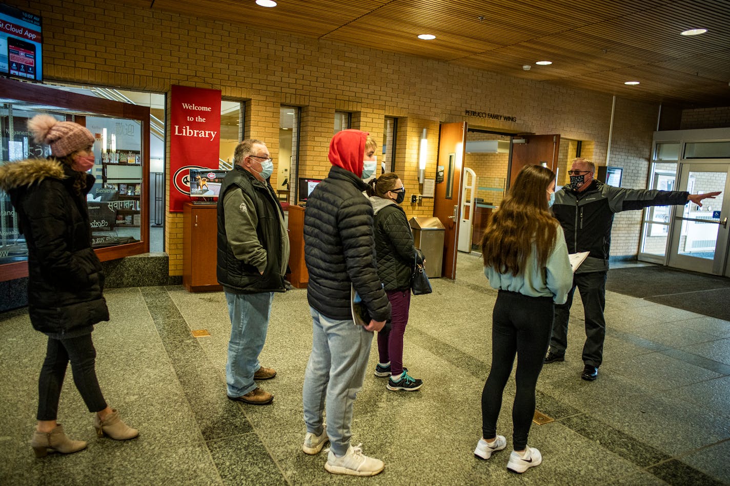 Admissions counselor John Brown gives a campus tour in St. Cloud, Minn., on Monday, March 14, 2022. Declining enrollment could bode ill for colleges like St. Cloud State.