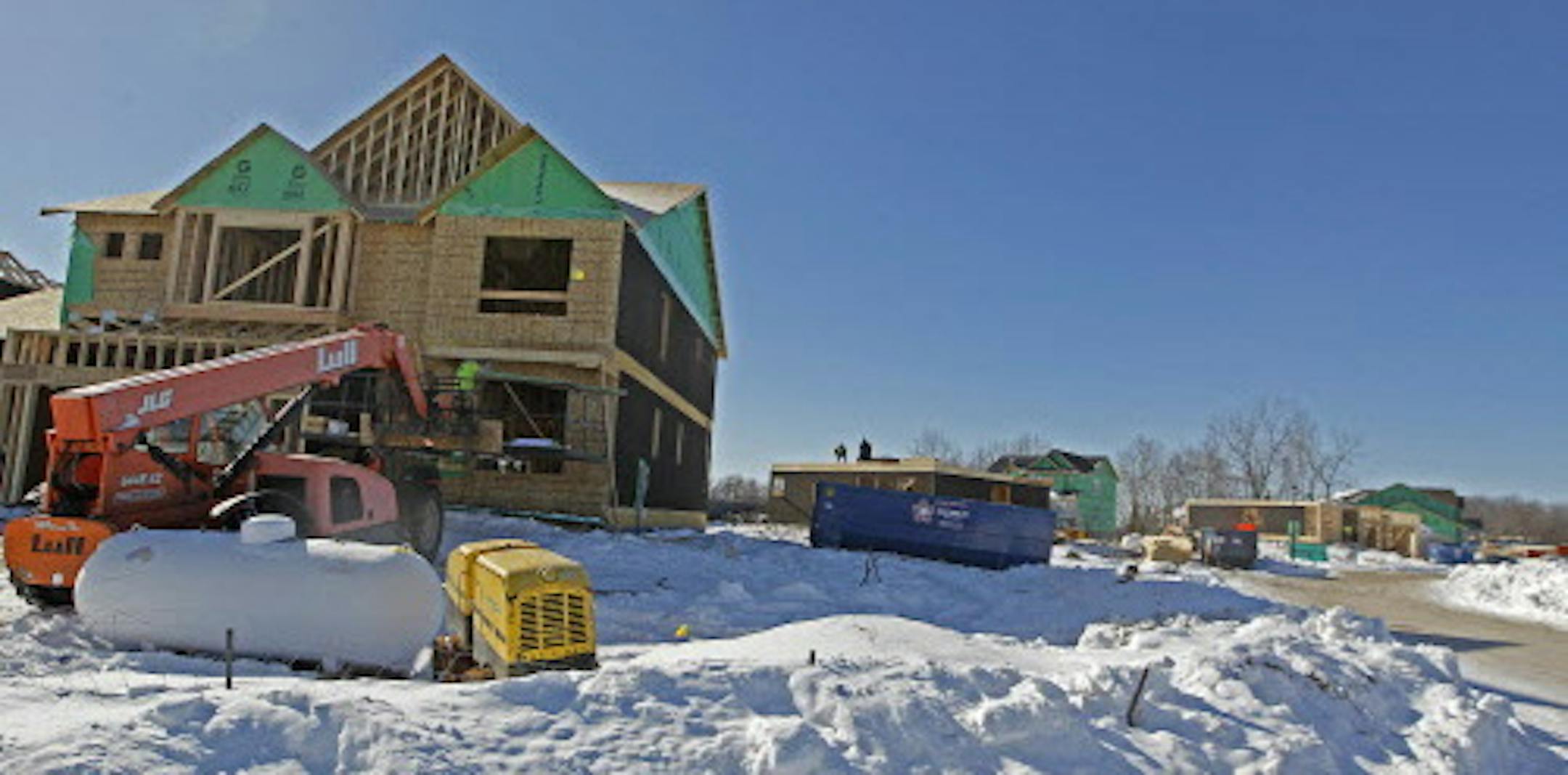 Construction went underway on many homes being built near Black Oaks Lane and 51st Avenue North, Monday, February 10, 2014 in Plymouth, MN. (ELIZABETH FLORES/STAR TRIBUNE) ELIZABETH FLORES • eflores@startribune.com