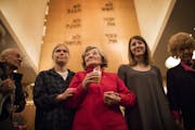 Holocaust survivor Renate Esquivel, center, is accompanied by her granddaughter Anna McCallum, to her left, and Holocaust survivor Reva Kibort, far ri