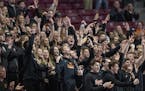 Farmington's fans celebrated a three-point shot as they took on Eden Prairie during the first half of their matchup in the Class 4A girls' basketball 