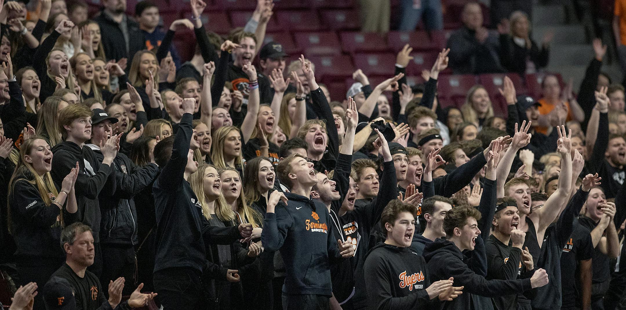 Farmington's fans celebrated a three-point shot as they took on Eden Prairie during the first half of their matchup in the Class 4A girls' basketball quarterfinals at Williams Arena.